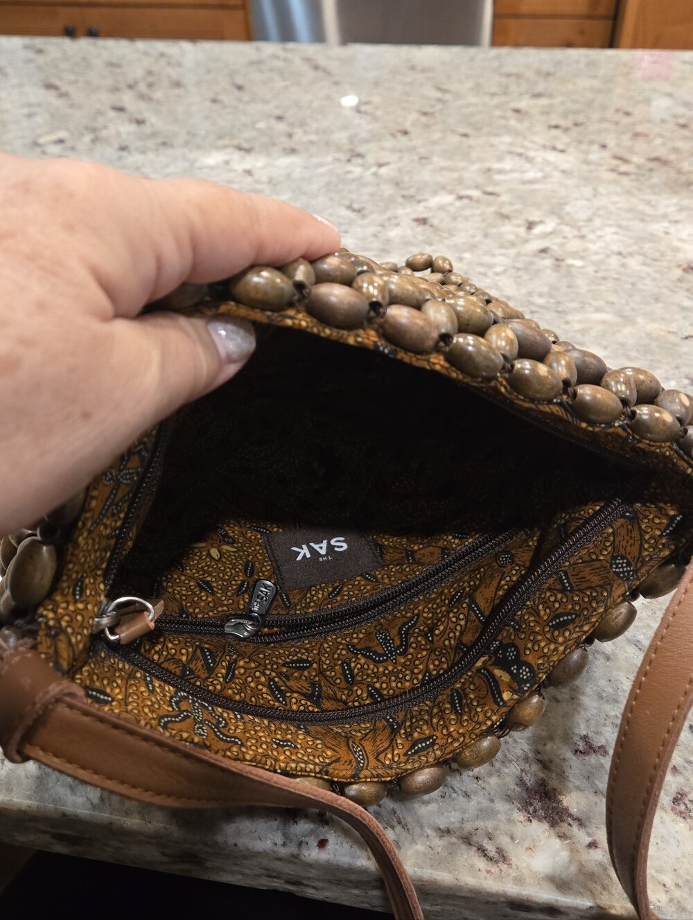 The Sak Tan Beaded Crossbody Bag with Patterned Interior